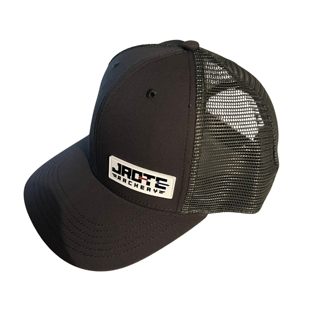 A gray trucker-style baseball cap with a gray mesh back and a white rectangular patch on the front that reads 'JROTC ARCHERY'.